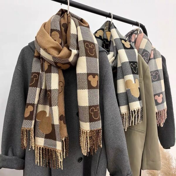 Women's plaid fringe scarves in black and white, camel, and pink color options